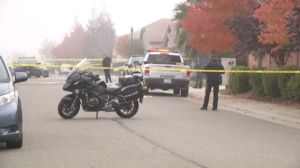 Law enforcement officials investigate the fatal stabbing in Elk Grove.